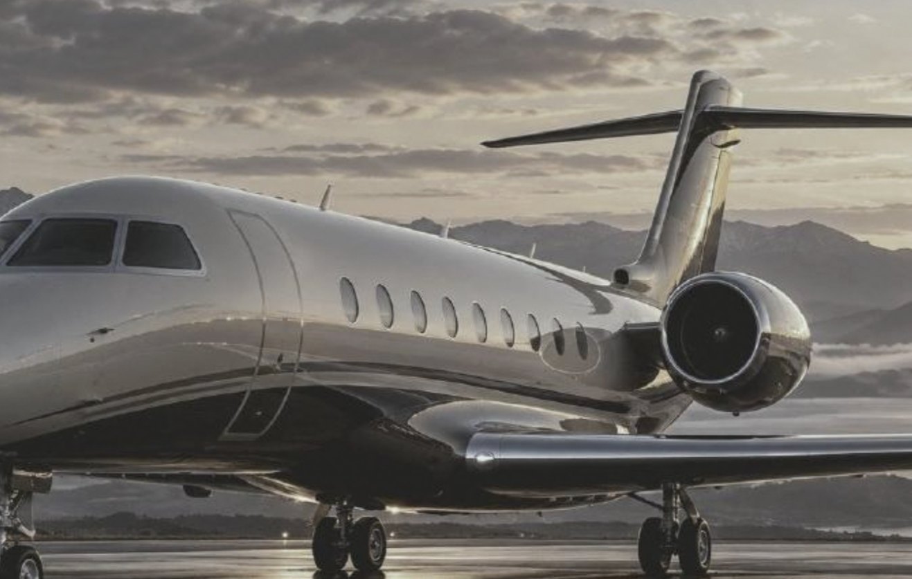 Private jet on the apron at dusk